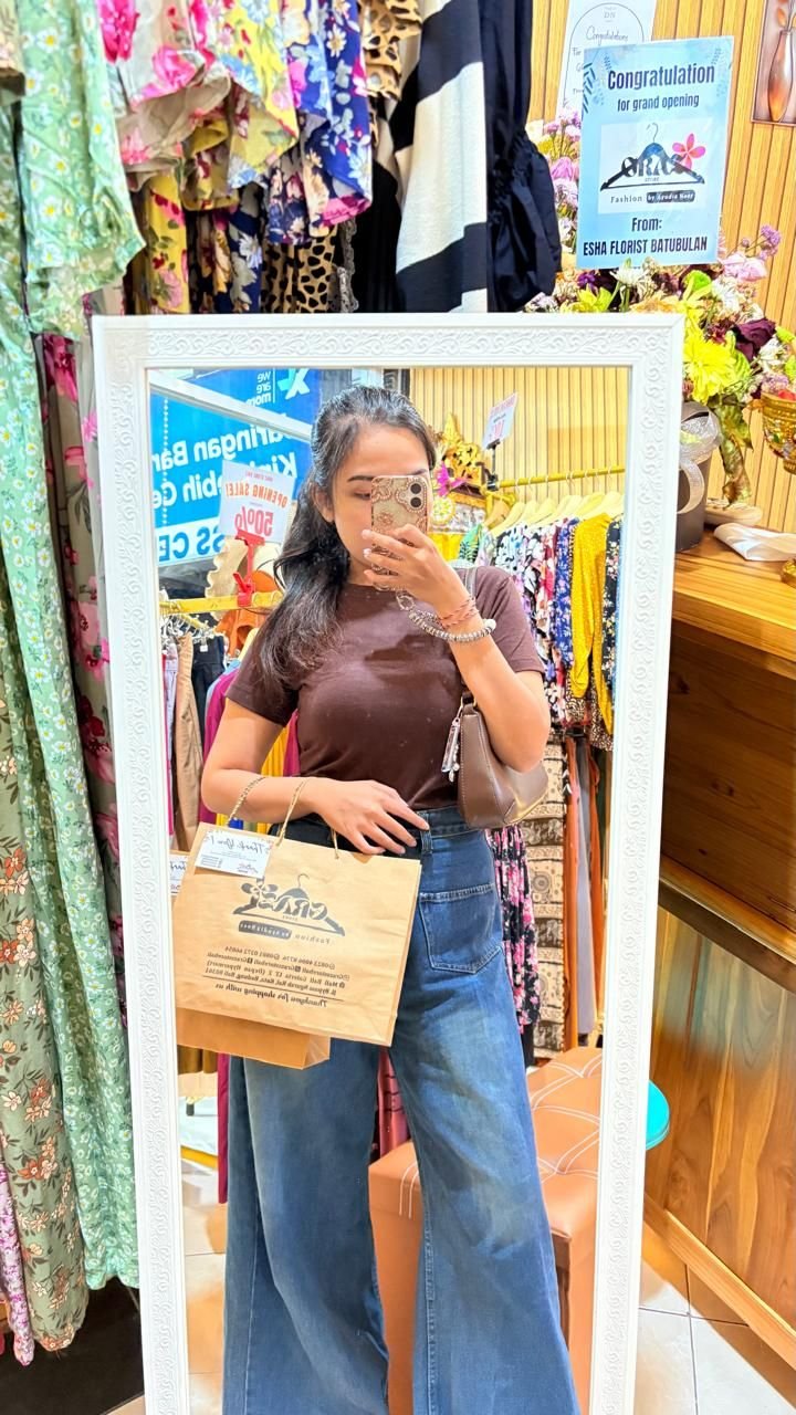 Trying on dresses in the shop