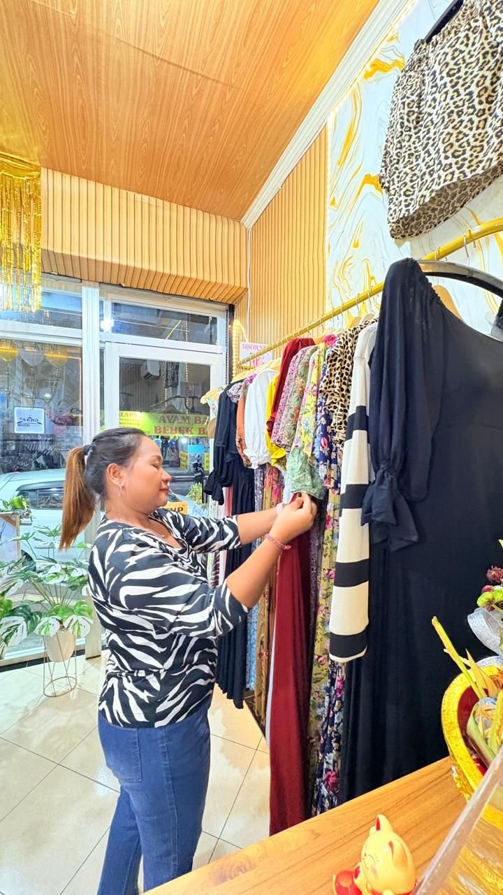 Our team arranging dresses